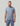 Blue-gray t-shirt with small teal and navy mountain and lake graphic on chest.