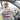 Gray t-shirt with red and white striped flag design and star graphic on back.