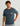 Heathered blue-gray short-sleeve t-shirt with circular logo graphic on chest pocket.