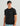 Man wearing black short-sleeve t-shirt with Huk logo patch on chest and black Huk cap.