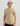 Tan short-sleeve t-shirt with small black "HUK" logo on chest.