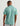 Huk men's Airweight Performance Polo in Mineral Blue Heather, quick-drying short-sleeve performance fishing shirt, side view