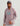 Man wearing mauve performance hoodie with turquoise HUK logo and sleeve text.