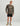 Man wearing mossy oak camouflage long-sleeve crew shirt with white logo and black shorts.