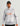 White and gray marble-pattern pullover hoodie with orange Huk logo and attached hood.