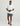Huk men's Airweight Performance Polo in White Palm Craze, stretch short-sleeve performance fishing shirt, back view