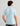 Huk men's Airweight Performance Polo in Coastal Drift Dolphin, quick-drying short-sleeve performance fishing shirt, side view