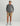 Man wearing gray heather 1/4 zip pullover with long sleeves and quarter-zip neckline.