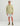 Sage green camo hoodie with small chest logo worn with white shorts and camo boots.