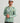 Huk men's Icon Performance Hoodie in Seagrass Camo, breathable long-sleeve fishing hoodie, back view
