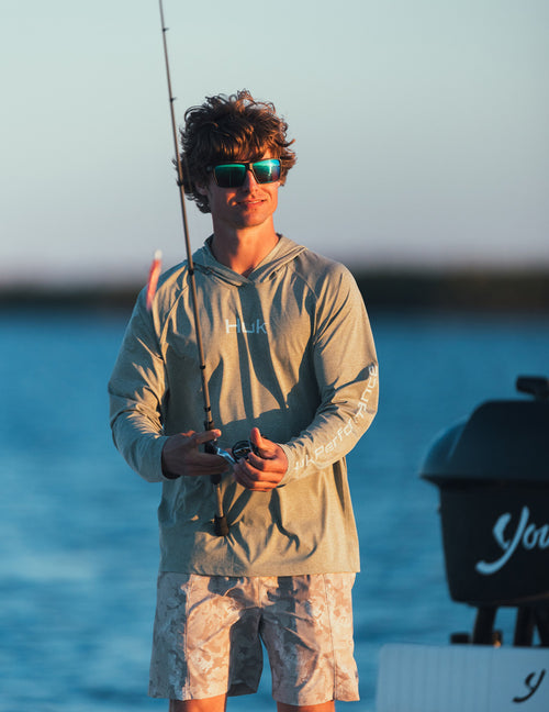 Huk men's Airweight KC Printed Short in River Rock Estuary Camo, stretch fishing shorts, worn on the water