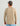 Beige long sleeve crew neck shirt with textured pattern, worn with gray cap and blue shorts, shown from back view.