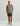 Camo and tan patterned hoodie with HUK logo on chest, worn with olive shorts and gray water boots.