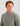 Gray fleece pullover with quarter-zip neckline and small chest logo on man against white background.