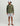 Sage green heathered quarter-zip fleece pullover worn with white shorts and a baseball cap.