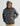 Charcoal gray Huk hoodie with kangaroo pocket, worn with tan cap and beige pants.