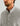 Man wearing light gray fleece pullover with snap button front closure and ribbed collar.