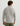 Man wearing gray fleece pullover with quarter-zip collar and olive pants, shown from back view.
