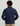 Man wearing navy cotton fleece pullover with quarter-zip neckline and ribbed cuffs, shown from back view.