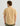 Man wearing tan button-down shirt with short sleeves and collar, paired with olive pants, shown from back.
