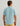 Man wearing light blue short-sleeve button-down shirt with yellow shorts, shown from back view.