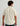 Men's cream textured button-down shirt with short sleeves, shown from back view.