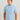 Man wearing light blue button-down shirt with small fish print pattern and short sleeves.