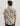 Men's short-sleeve button-down shirt with cream, tan, and navy floral leaf print pattern.