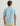 Blue button-down shirt with cream tropical print, short sleeves, worn with yellow shorts.