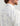 Huk men's KC Tide Point Short Sleeve Button-Down in White Lures, quick-drying button-down fishing shirt, fabric and stitching close-up