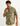 Man wearing sage green patterned short-sleeve button-down shirt with chest pocket and white buttons.