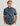 Men's short sleeve button-down shirt in blue with dark abstract pattern and chest pockets.