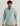 Light blue heathered ripstop button-down shirt with chest pocket, worn by man against neutral background.