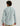 Man wearing light blue heathered ripstop button-down shirt, rear view.