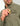Man wearing sage green button-down shirt with chest pocket, holding gold and brown lighter.