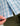 Blue and pink plaid long sleeve button-down shirt with brand label visible on fabric.
