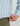 Blue and pink plaid long sleeve button-down shirt worn with olive green pants.