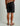 Huk men's Next Level 10.5-inch Short in Black, moisture-wicking fishing shorts, back view, alternate angle
