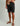 Huk men's Next Level 10.5-inch Short in Black, stretch fishing shorts, front view, alternate angle