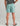 Huk men's Pursuit Volley Swim Short in Mineral Blue, quick-drying fishing shorts, side profile view
