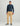 Tan Drift Pant with flat front and straight leg fit, styled with navy hoodie.