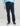 Navy straight-leg pants with flat front waistband and side pockets on model wearing light blue shirt.