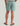 Huk men's Shoreside Short in Silver Blue, stain-release fishing shorts, side profile view