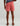 Huk men's Shoreside Short in Mineral Red, antimicrobial fishing shorts, side profile view
