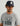 Navy baseball cap with white rope trim and embroidered patch on front.