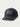 Black performance cap with gray Huk logo patch on front, perforated mesh panels on sides, and gray piping detail on bill.