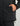 Black 3-layer jacket with zippered pocket and fleece-lined cuff detail shown on model.