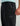 Black HUK pants with elastic waistband, side pockets, and gray logo on thigh.