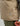 Beige quilted insulated vest with center front zipper and brand logo patch on torso.