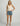 Huk women's Bayside Tank in Egret, 4-way stretch fishing tank top, back view